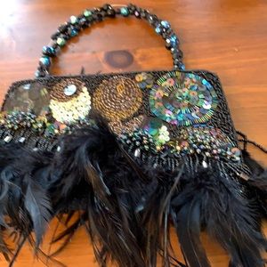 Beaded and feathered evening bag. Multi tones.